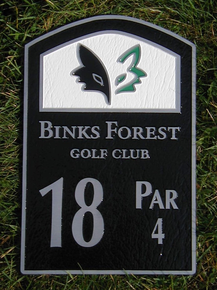 cast metal tee sign
