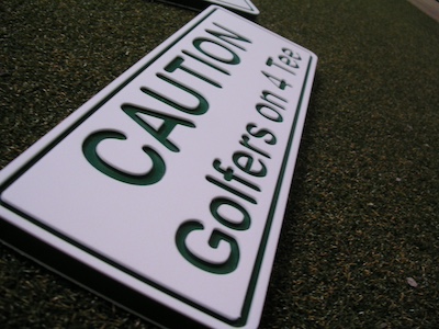 routed white green white directional sign