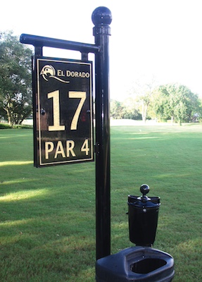 carved black granite tee sign with ball washer and waste can 