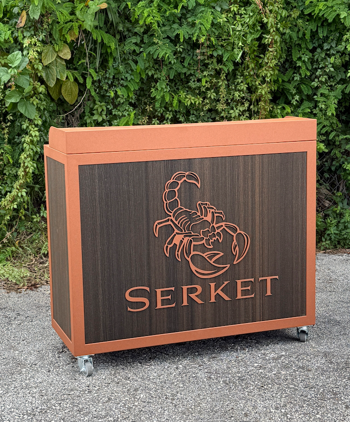 brown podium with logo and brand name in cut metal 